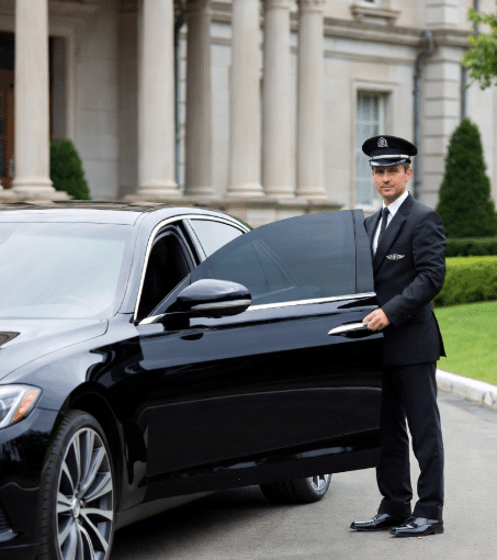 Black executive limo waiting at Kingston waterfront for Pearson Airport transfer.