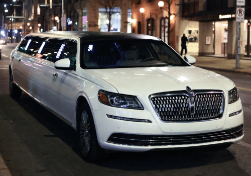A white Lincoln stretch limo parked in downtown Toronto for a prom night group pickup