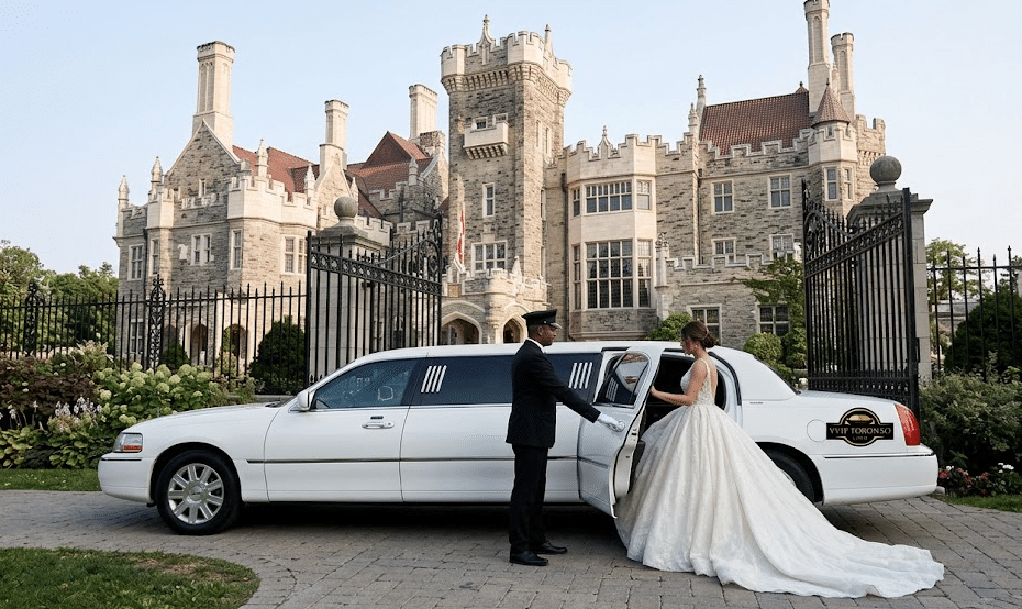 White 10-Passenger stretch wedding limousine arriving via the private Davenport Road entrance at Casa Loma for an intimate terrace first look photo shoot.
