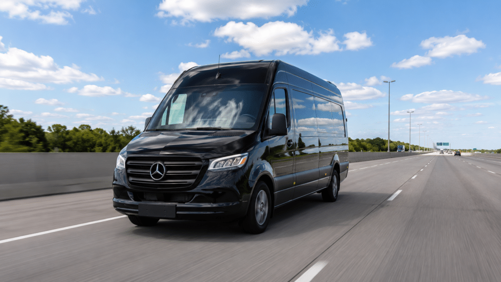 Executive Mercedes-Benz Sprinter van navigating Highway 401 east toward Ajax.