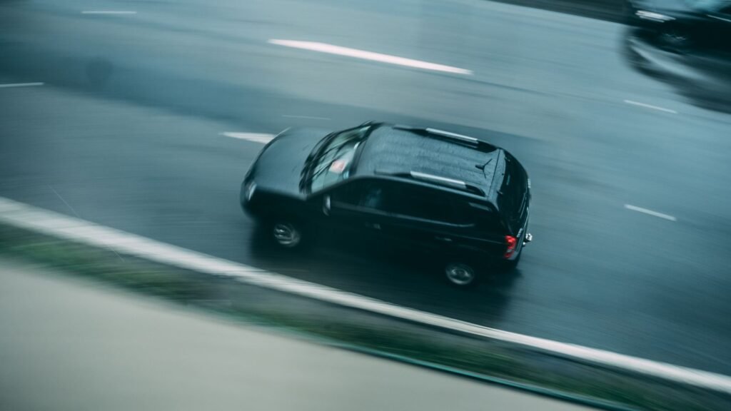 Black SUV driving on a highway