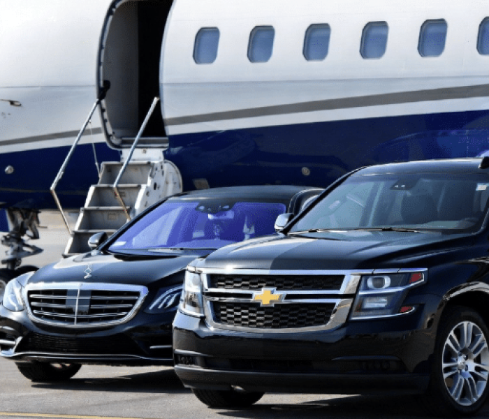 Private jet Toronto FBO with a luxury car parked airside for immediate boarding.